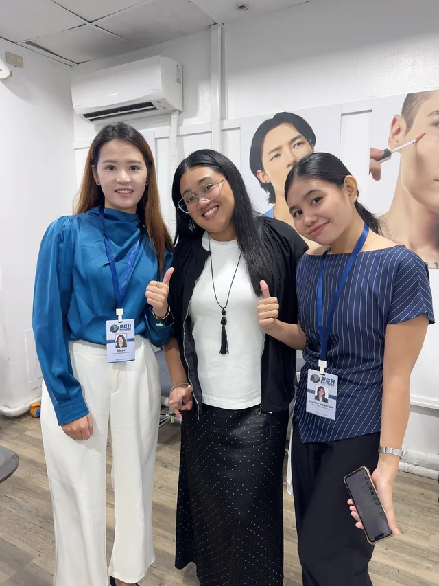 PGH team members and a client standing together during a business visit